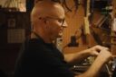 Repair technician working on a violin in The Last Repair Shop short film