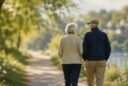 Two older adults walking side by side, symbolizing the quiet ways relationships shape who we become over a lifetime.
