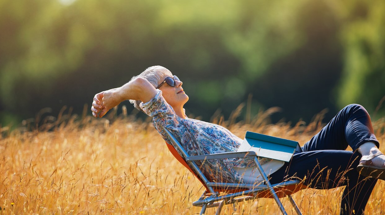 Older adult enjoying a simple, peaceful moment, reflecting the idea of having enough in later life.